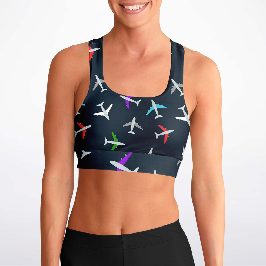 Front view of a woman wearing an airplane-patterned padded sports bra, showcasing the vibrant aviation-themed design and comfortable, supportive fit.